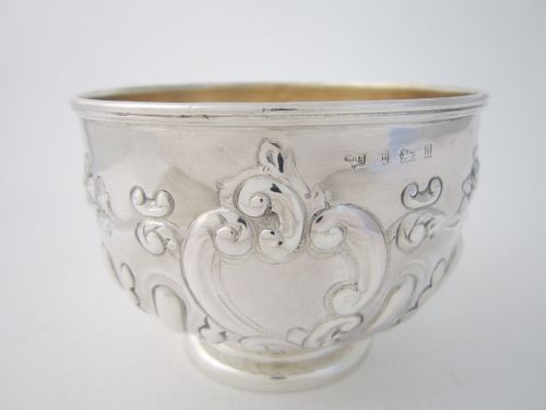 fig 1. An Edwardian sterling silver bowl featuring embossed scrollwork decoration and a gilt interior.