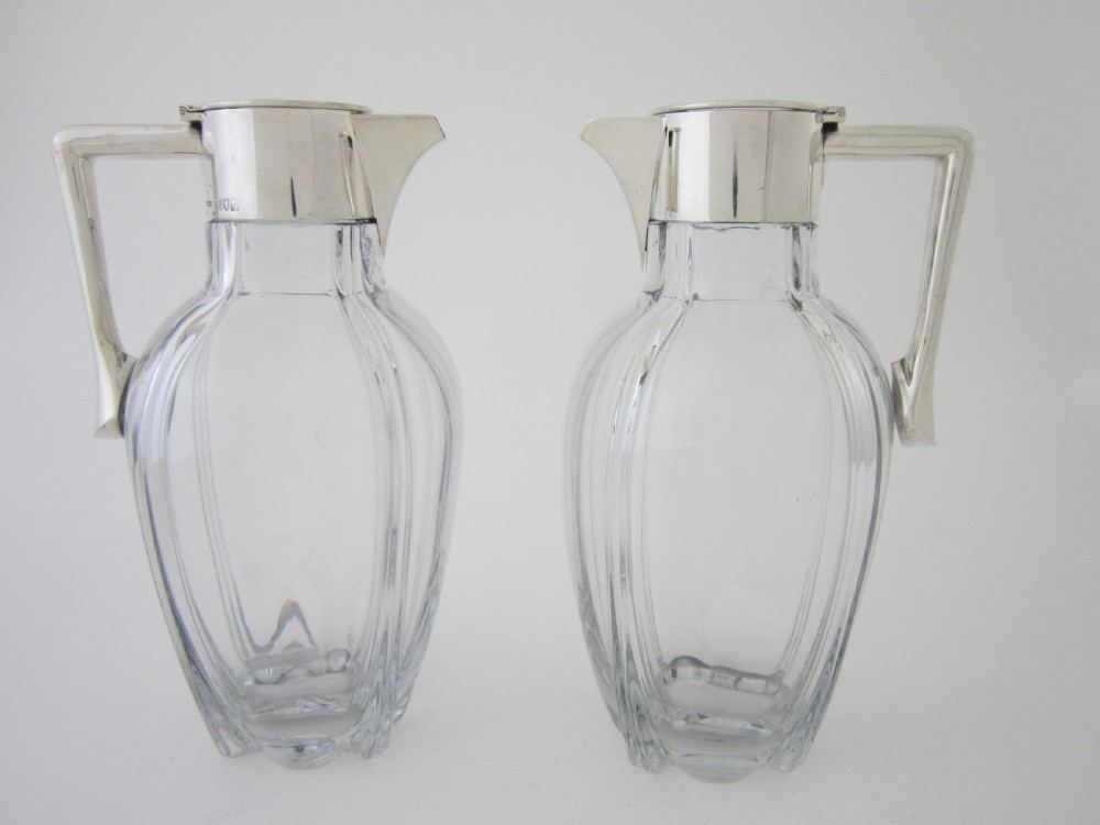 Victorian Silver and glass claret jugs