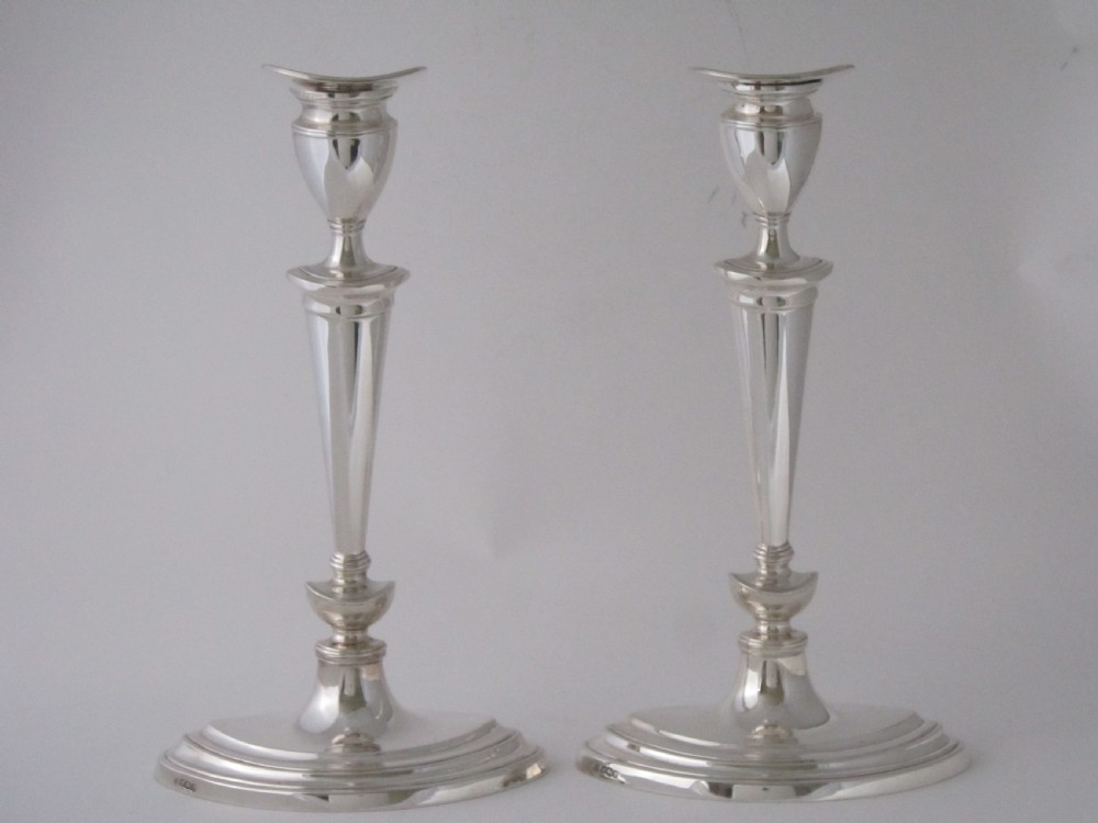 A pair of Antique George V Sterling silver candlesticks
