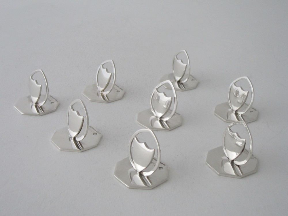A set of eight Antique Edwardian Sterling silver menu/place card holders