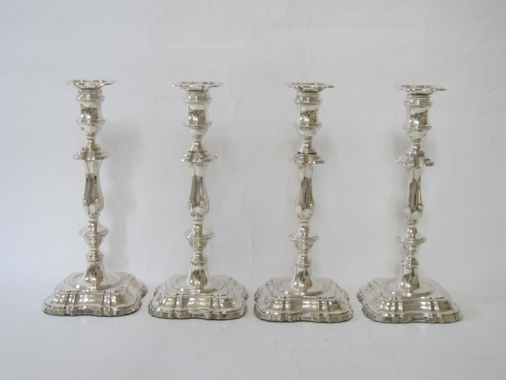 Set of four Antique George v Sterling silver candlesticks