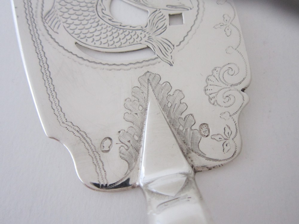 An Irish George IV sterling silver fish slice with a pierced fish motif on the blade and a fiddle pattern handle. View III