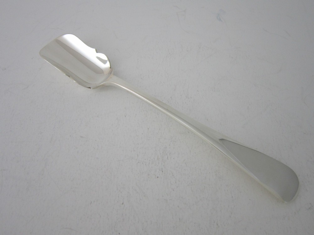 A polished sterling silver Stilton scoop featuring a spade-shaped blade and a plain Old English pattern handle.