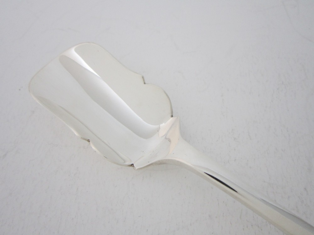 A polished sterling silver Stilton scoop featuring a spade-shaped blade and a plain Old English pattern handle. View II