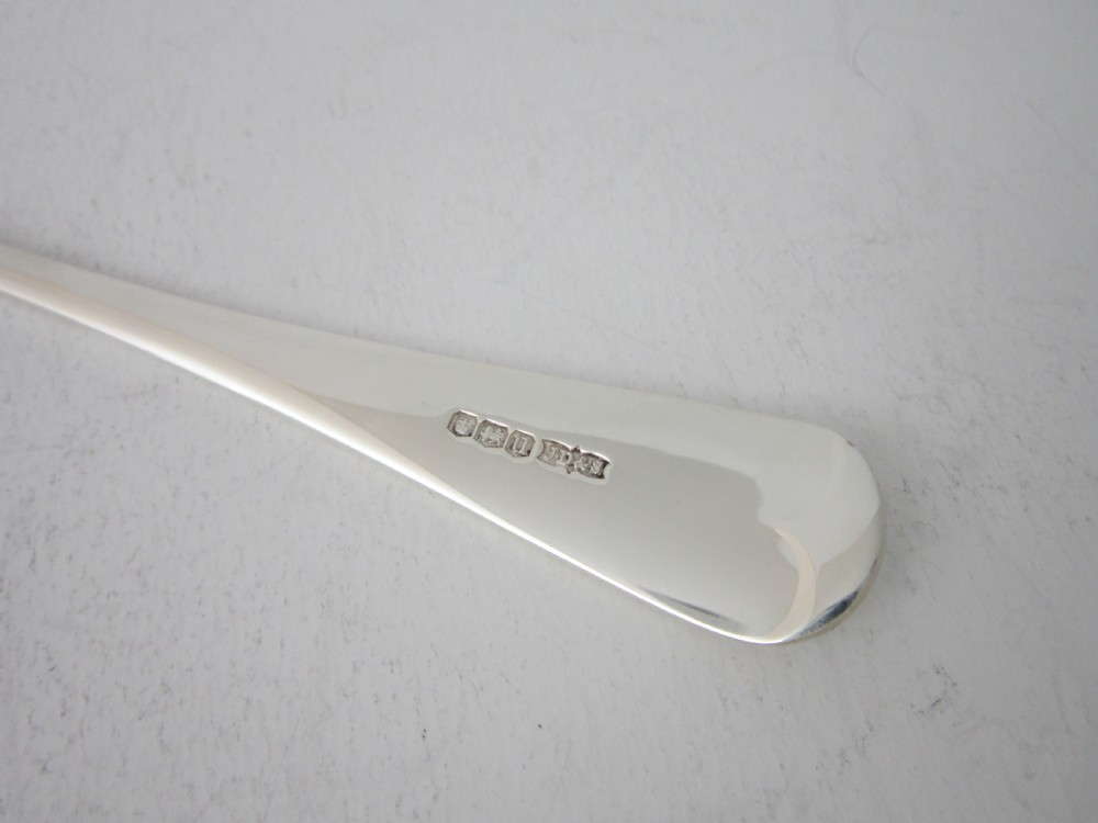 A polished sterling silver Stilton scoop featuring a spade-shaped blade and a plain Old English pattern handle. View VI