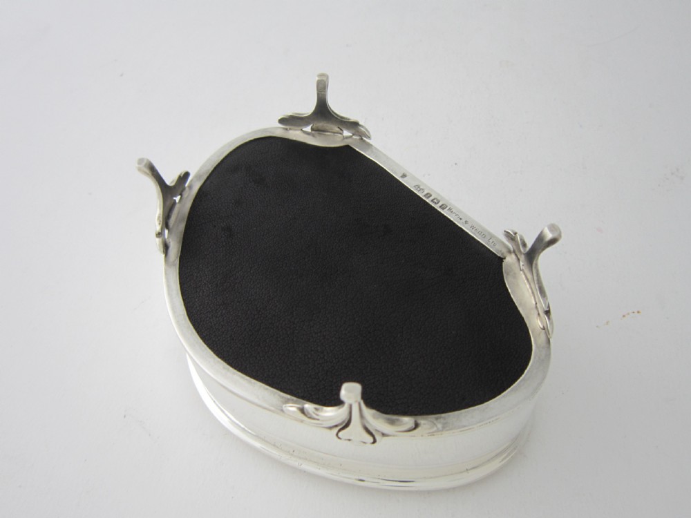An antique George V sterling silver trinket box with a smooth shaped hinged lid, beaded trim, and four raised feet. View VII