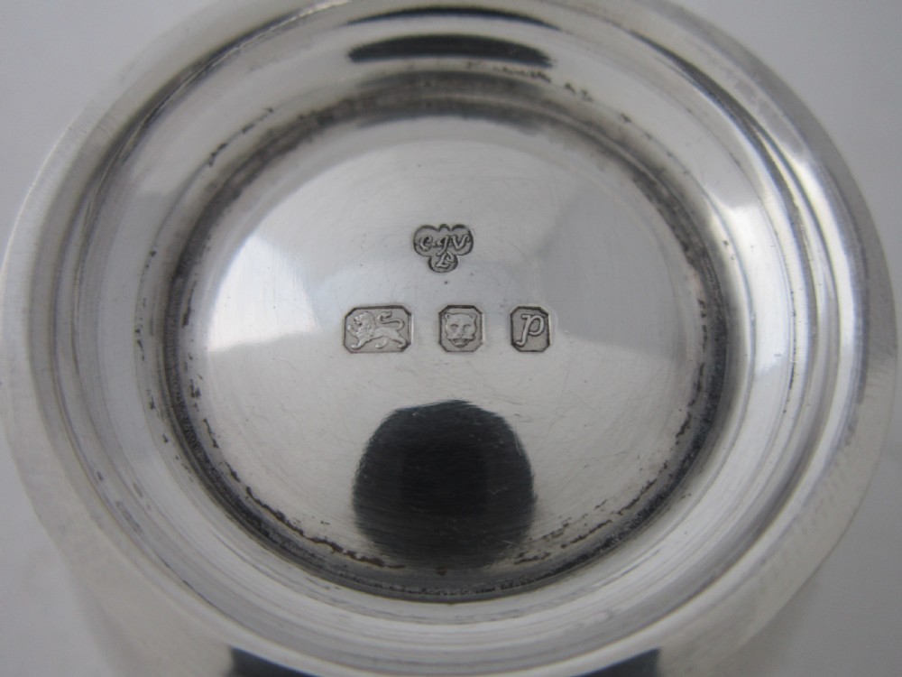 A solid sterling silver double-handled tea strainer with a pierced star bowl pattern and scrolled side handles. View VI