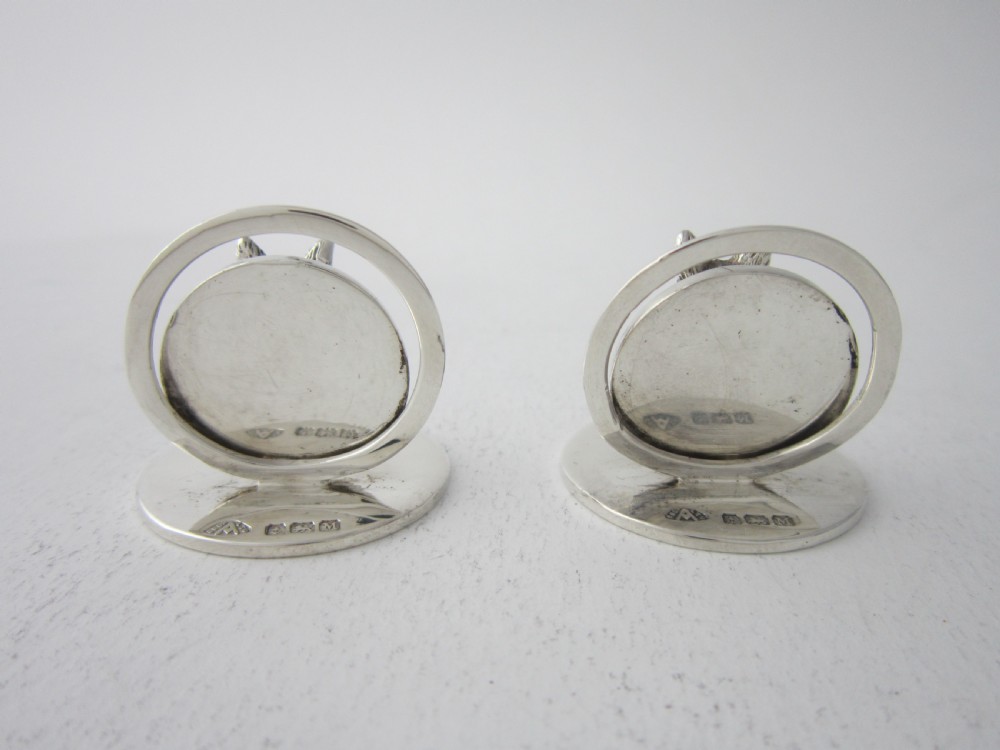 A pair of sterling silver place card holders featuring sculpted fox heads mounted on circular silver bases. View IV
