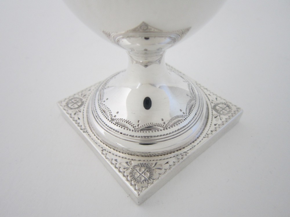 A five-piece sterling silver tea and coffee set featuring carved wooden handles, engraved oval cartouches, a teapot with stand, coffee pot, cream jug, and sugar basket. View XIII