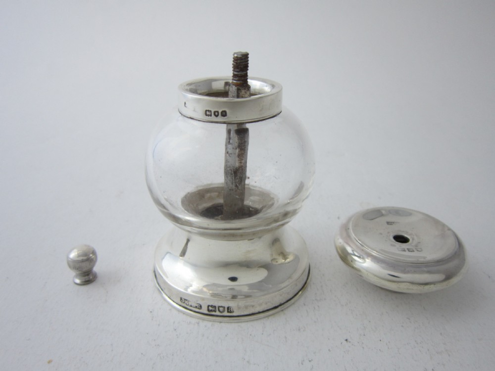 Victorian sterling silver and clear glass pepper grinder featuring hallmarked silver rims and a turned top knob. View III