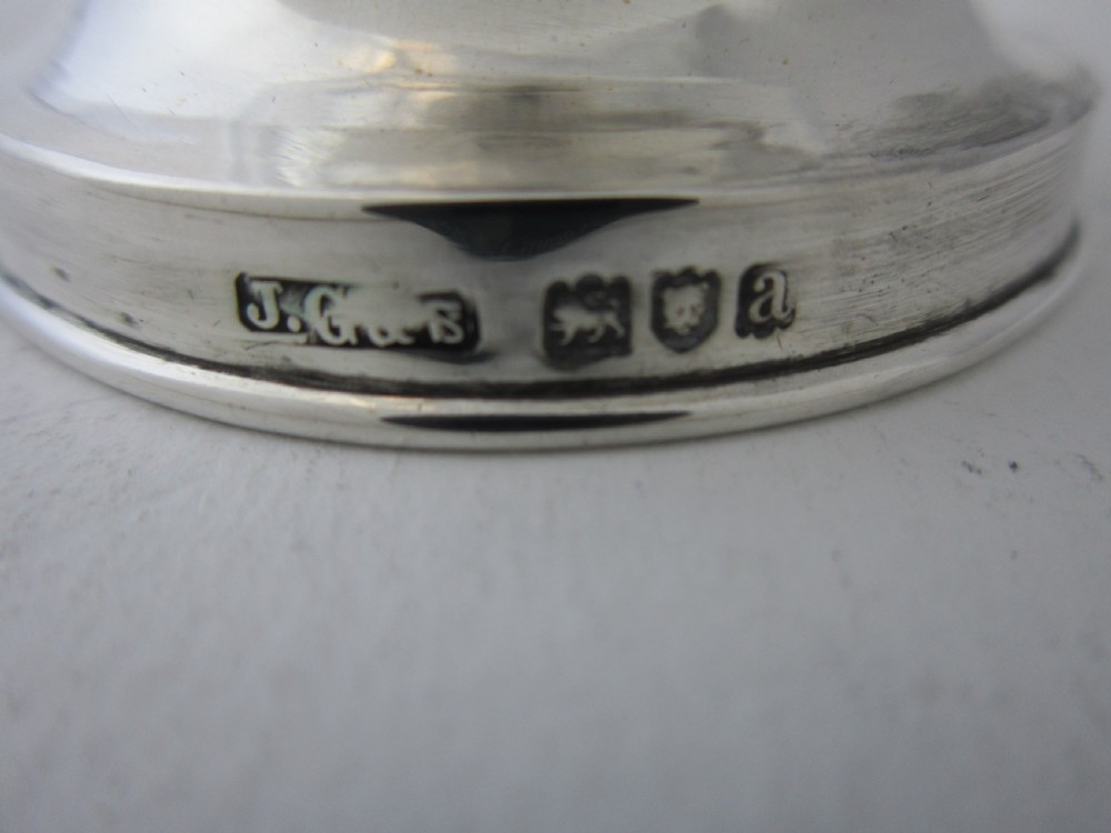 Victorian sterling silver and clear glass pepper grinder featuring hallmarked silver rims and a turned top knob. View V
