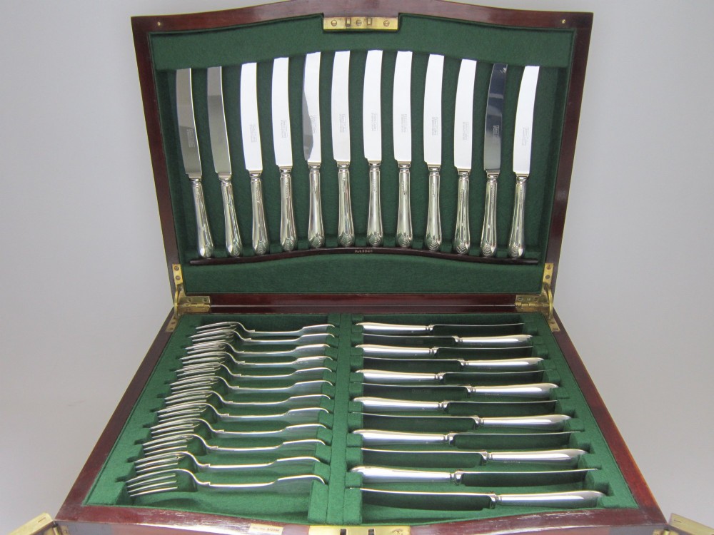 An open Victorian mahogany canteen chest fitted with drawers displaying a full sterling silver fiddle pattern cutlery service lined in green fabric. View III