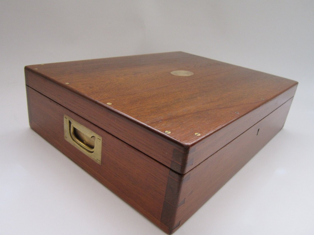 An open wooden canteen box lined with blue fabric displaying a complete set of Victorian sterling silver fiddle pattern cutlery. View IV