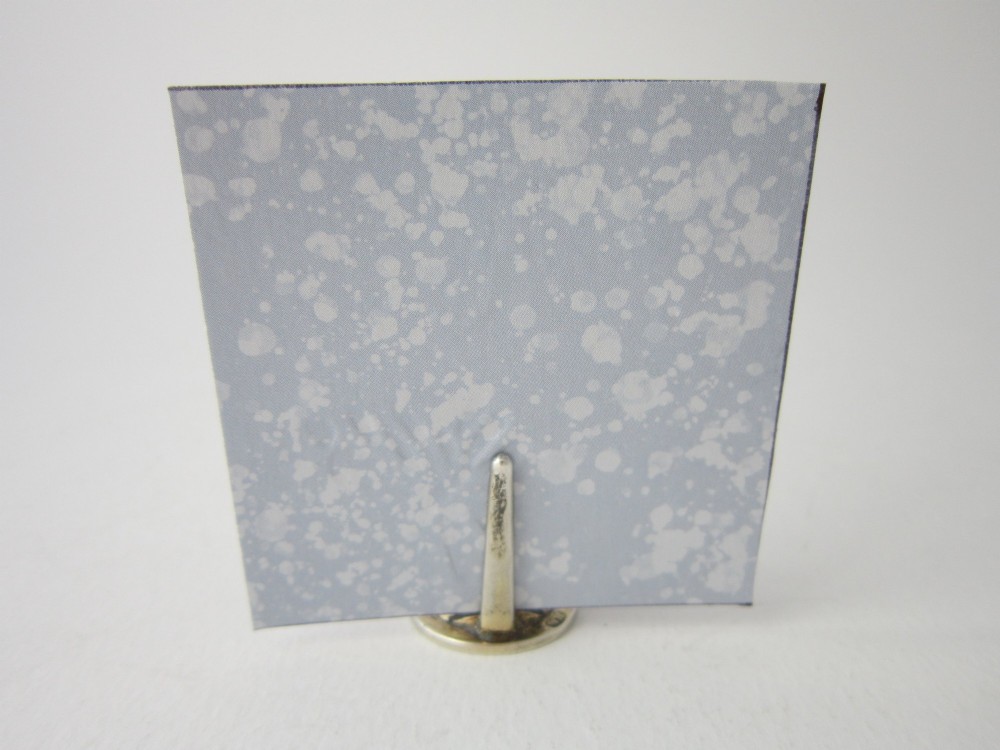 A set of four Edwardian sterling silver place card holders featuring pink guilloche enamel columns topped with sculpted game birds inside a fitted presentation box. View X