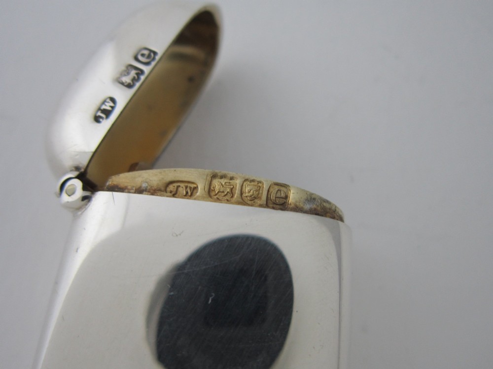 A late Victorian hallmarked sterling silver combination sovereign holder and vesta case shown open, featuring a spring-loaded coin mechanism and top suspension loop. View V