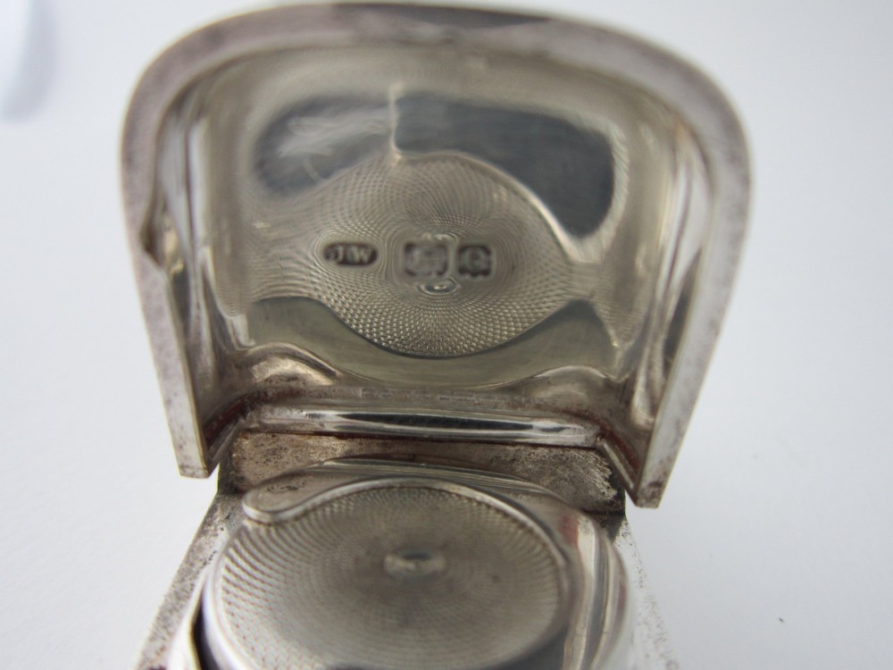 A late Victorian hallmarked sterling silver combination sovereign holder and vesta case shown open, featuring a spring-loaded coin mechanism and top suspension loop. View VI