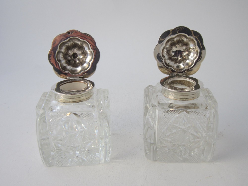 A George V sterling silver tray featuring a pierced gallery, scroll feet, a central pen recess, and two square cut-glass inkwells with silver lids. View VIII