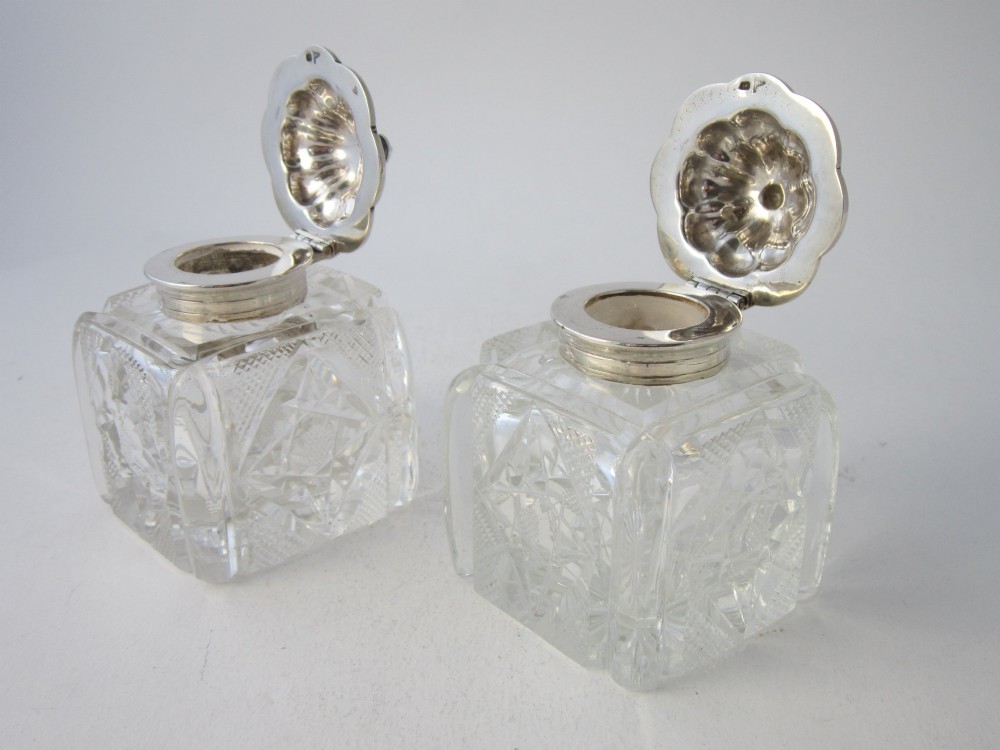 A George V sterling silver tray featuring a pierced gallery, scroll feet, a central pen recess, and two square cut-glass inkwells with silver lids. View IX