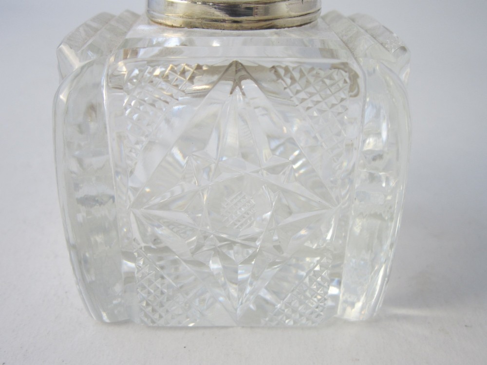 A George V sterling silver tray featuring a pierced gallery, scroll feet, a central pen recess, and two square cut-glass inkwells with silver lids. View XI