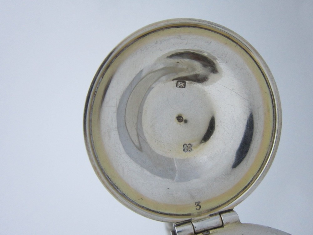 A Victorian clear glass claret jug with an engraved sterling silver collar, hinged lid with finial, and an ornate scroll handle. View VIII