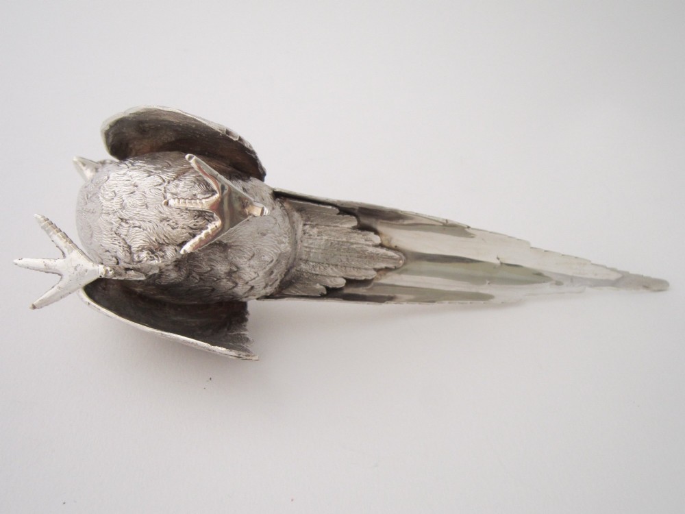 A pair of detailed cast sterling silver pheasants portrayed in naturalistic poses against a light background. View VII