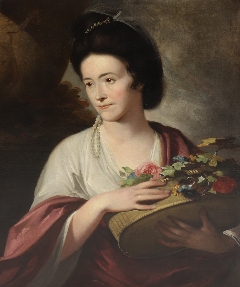 An 18th-century oil portrait of a lady holding a basket of flowers, framed in a carved gilt frame. View II