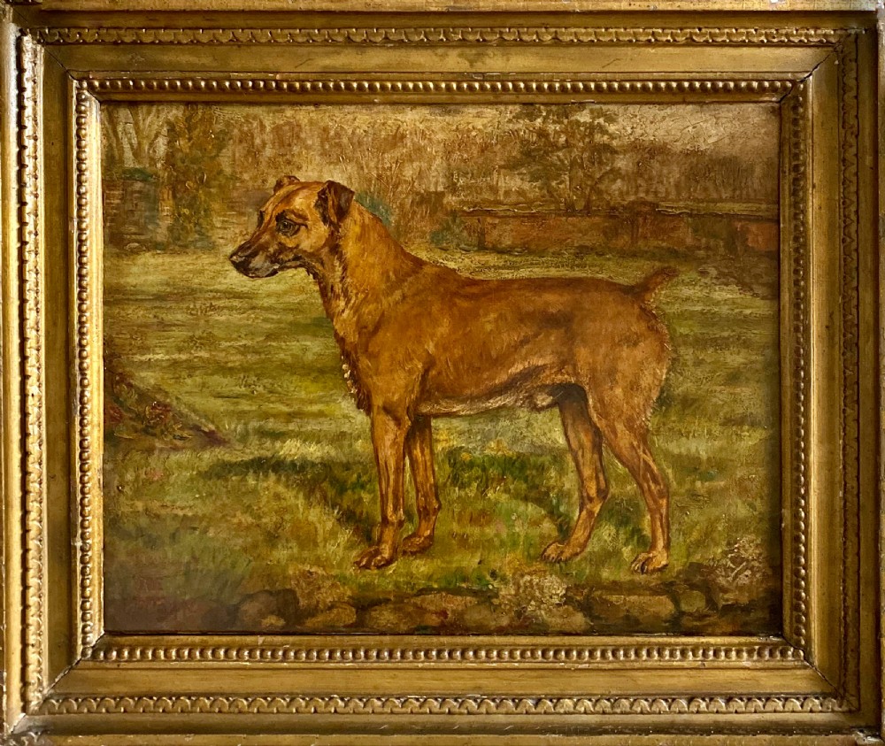 A 19th-century oil painting depicting a brown terrier standing profile in a garden setting, presented in a beaded giltwood frame.