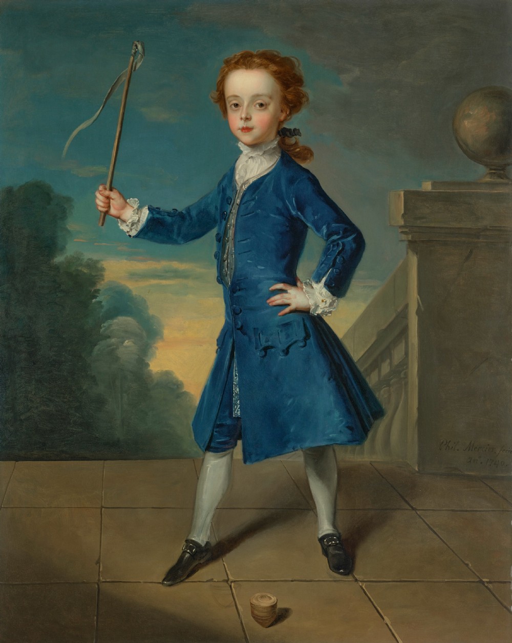 An 18th-century full-length oil painting of a young boy in a blue coat holding a whip beside a spinning top, set within a carved gold frame. View II