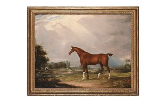 A nineteenth-century oil painting on canvas depicting a chestnut horse standing in profile within a rural river landscape, housed in a moulded gilt frame.
