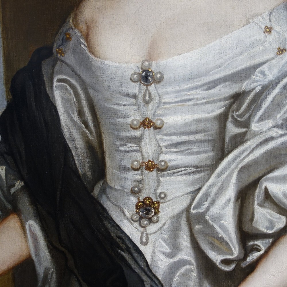 A 17th-century oil painting depicting a lady wearing a white satin gown and pearl jewellery set in a carved gold leaf frame. View III