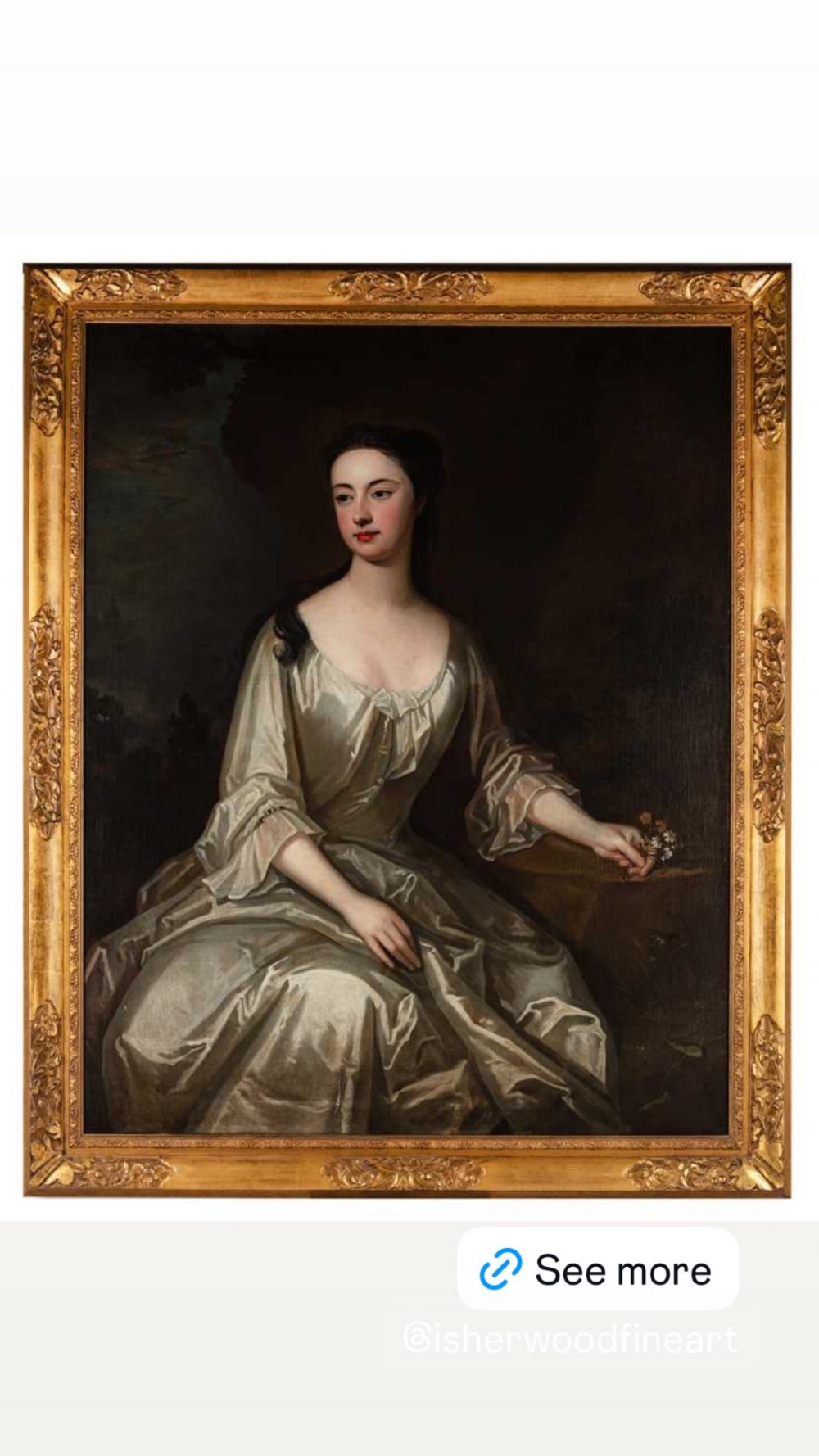 An early eighteenth-century oil painting on canvas depicting a seated lady in a silk gown within a carved giltwood frame.