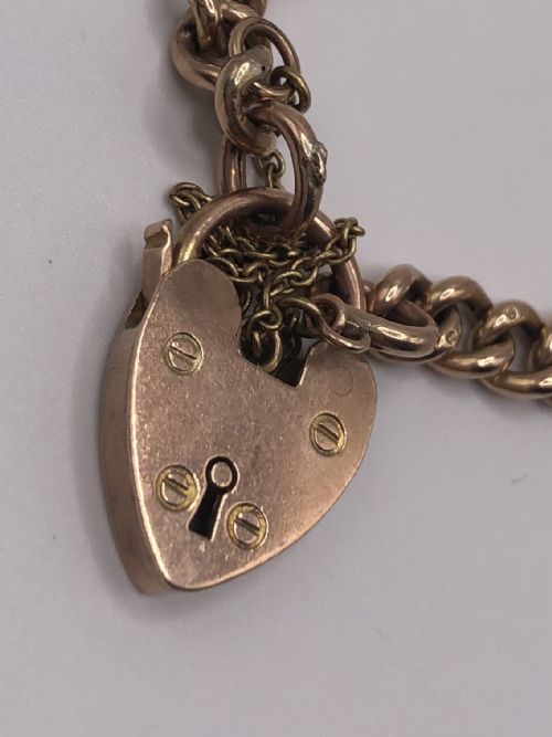 fig 1. An antique Edwardian 15ct yellow gold chain featuring long paperclip links alternating with small circular connecting links.