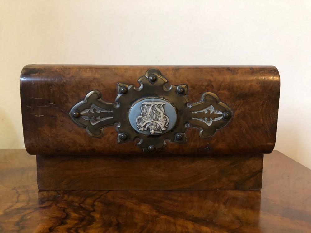 A rectangular Victorian burr walnut box featuring decorative brass strapwork and a central oval blue cameo plaque depicting classical figures. View IV