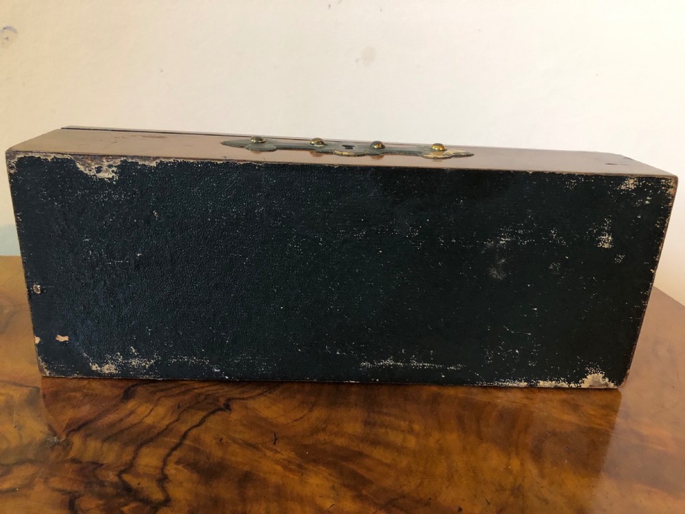 A rectangular Victorian burr walnut box featuring decorative brass strapwork and a central oval blue cameo plaque depicting classical figures. View VI