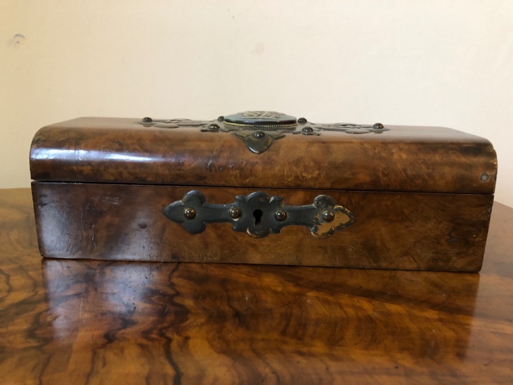 A rectangular Victorian burr walnut box featuring decorative brass strapwork and a central oval blue cameo plaque depicting classical figures. View VII