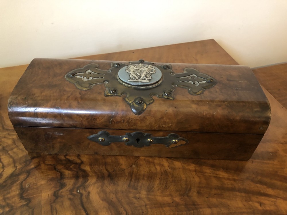 A rectangular Victorian burr walnut box featuring decorative brass strapwork and a central oval blue cameo plaque depicting classical figures.