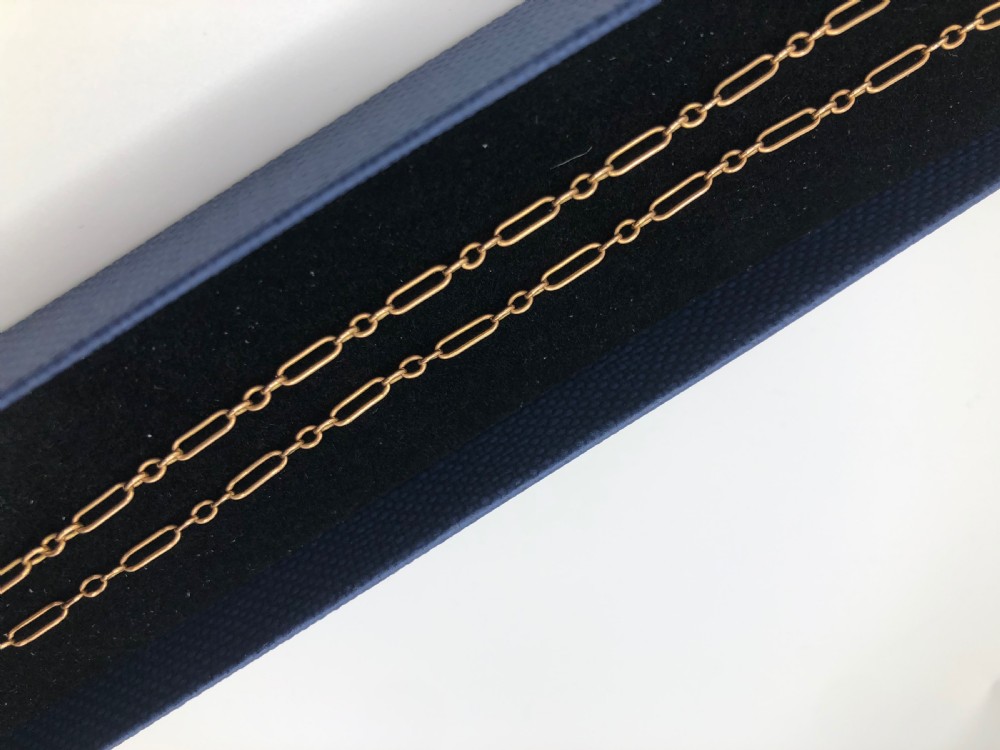 An antique Edwardian 15ct yellow gold chain featuring long paperclip links alternating with small circular connecting links. View III