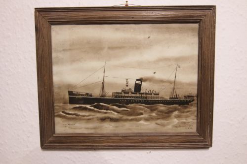 fig 1. A framed sepia maritime painting depicting the steamship T.S.S. Nevasa navigating choppy ocean waves.