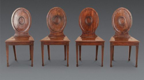 SET OF FOUR GEORGE III MAHOGANY HALL CHAIRS - ADDITIONAL PHOTO 1