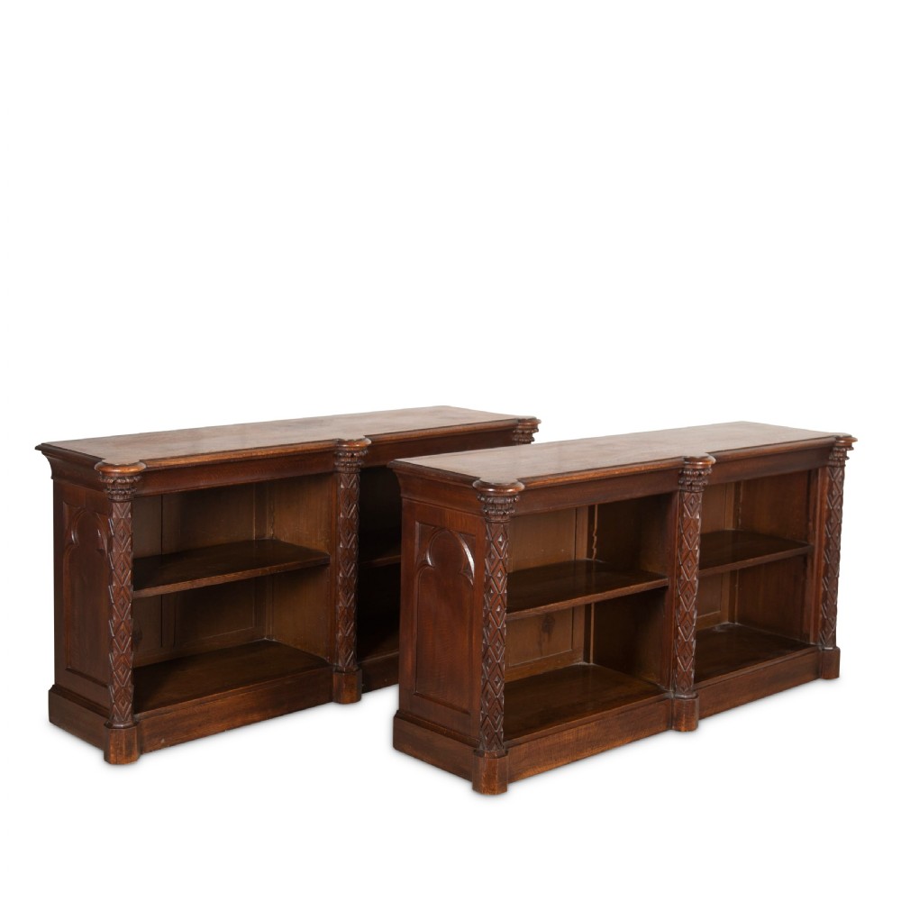 A pair of 19th-century dark wood low open bookcases featuring carved pilasters and open shelves. View IV