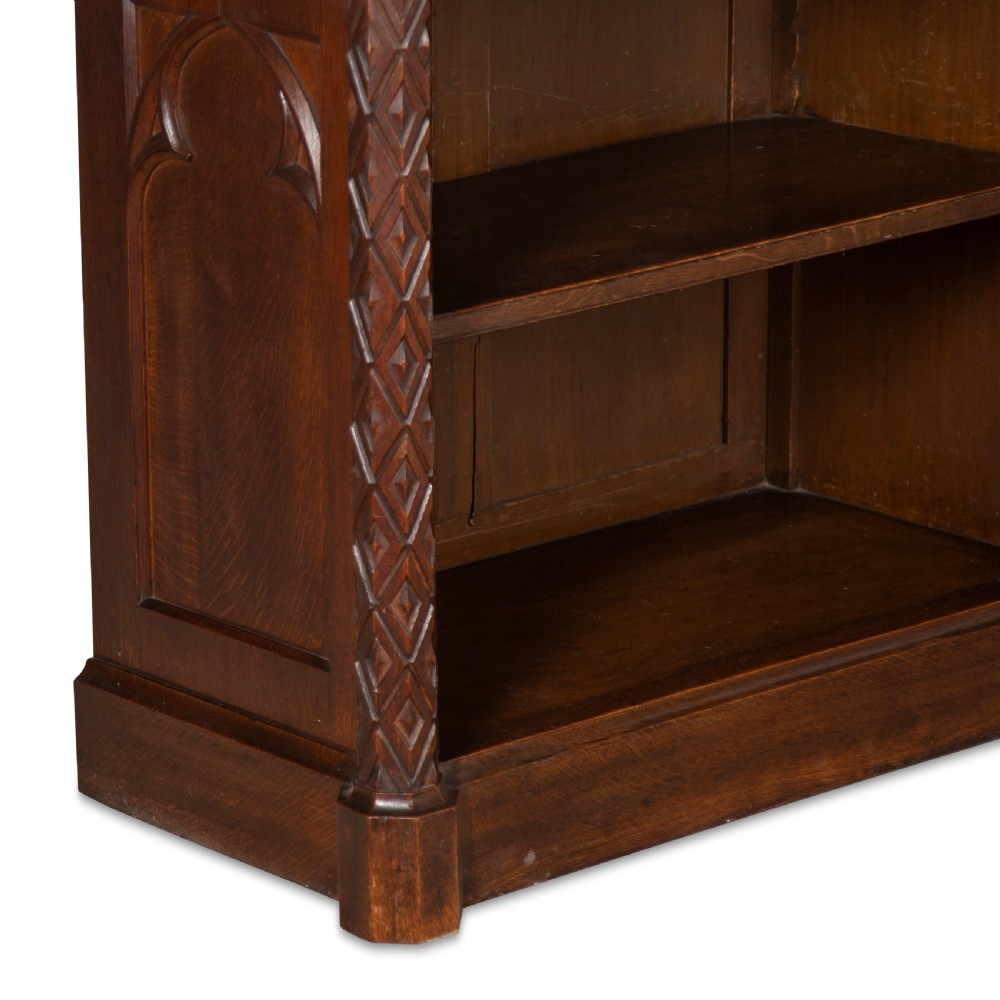 A pair of 19th-century dark wood low open bookcases featuring carved pilasters and open shelves. View XI