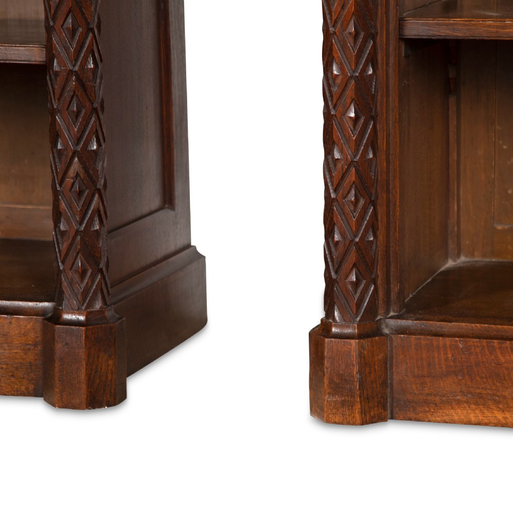 A pair of 19th-century dark wood low open bookcases featuring carved pilasters and open shelves. View XIII