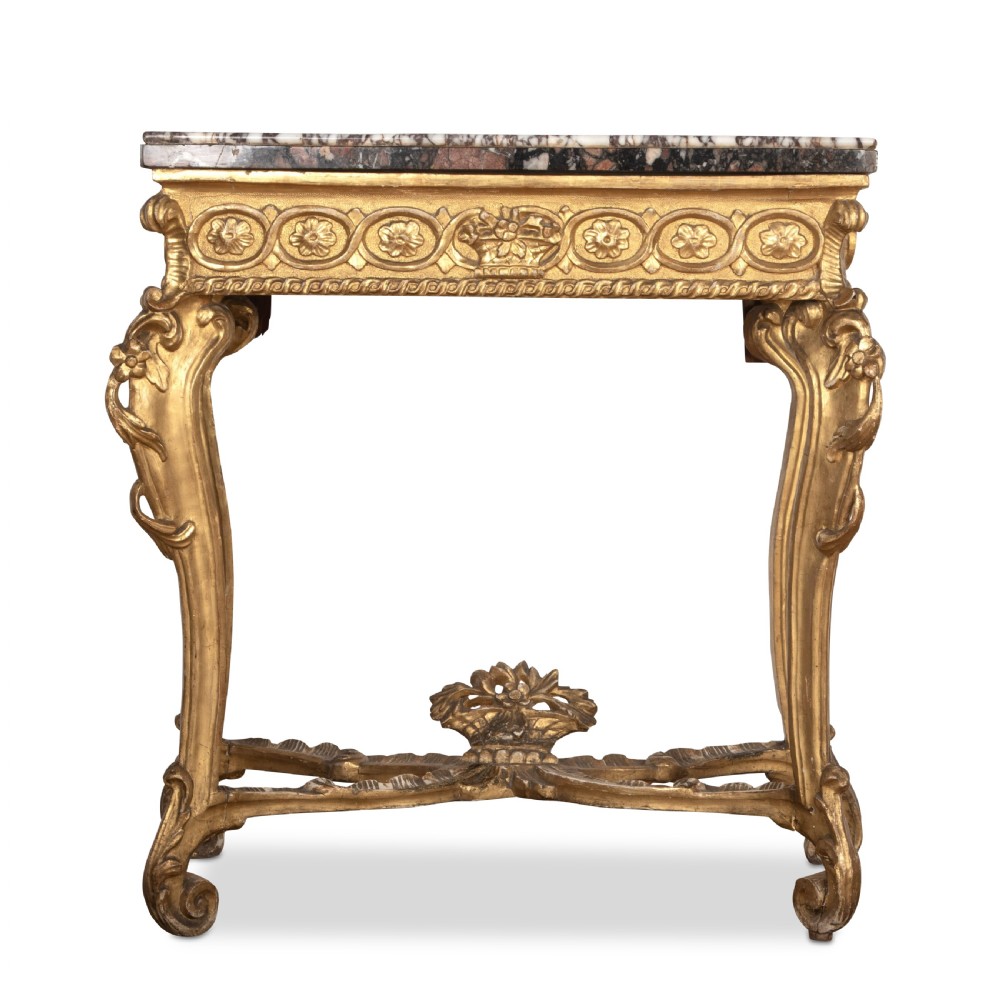 An 18th-century giltwood console table featuring a dark mottled marble top, carved apron with rosette motifs, and cabriole legs linked by an X-shaped stretcher. View II