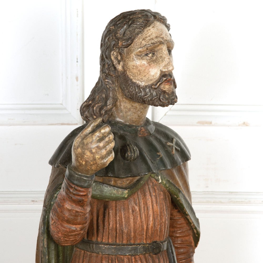 An 18th-century carved wooden polychrome statue depicting Saint Roch standing on a square timber base. View IV