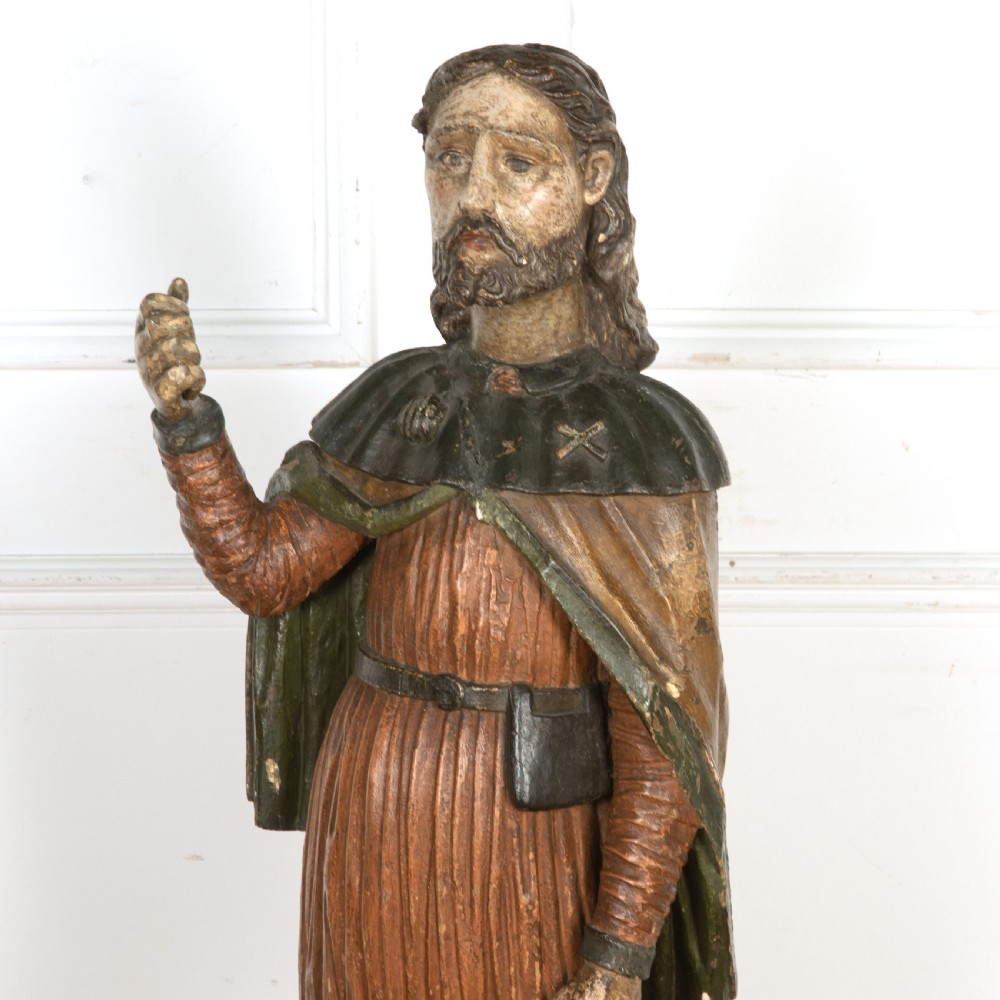 An 18th-century carved wooden polychrome statue depicting Saint Roch standing on a square timber base. View VI
