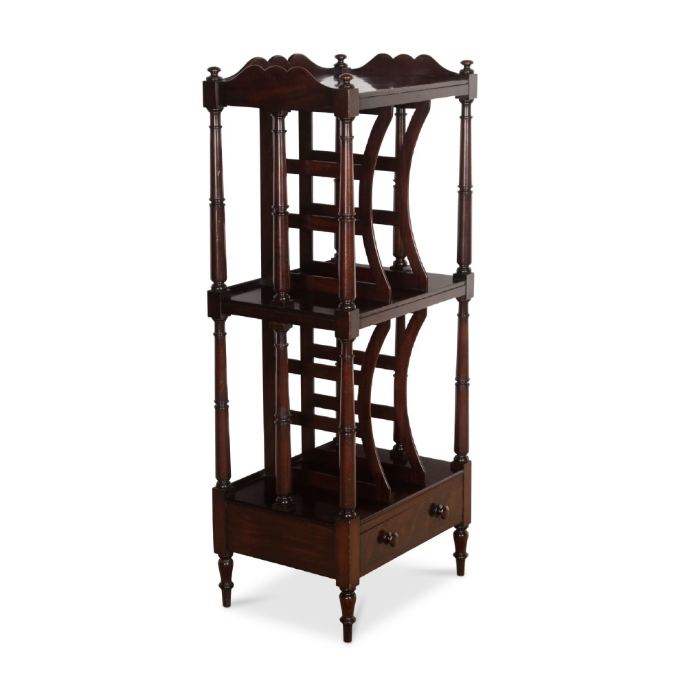 A tall dark mahogany etagere featuring three open shelves, vertical music dividers, turned spindle supports, a top gallery rail, and a single bottom drawer with turned wooden knobs. View II