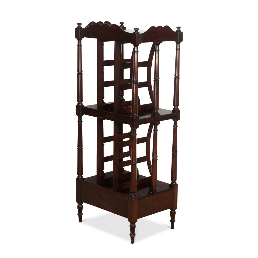 A tall dark mahogany etagere featuring three open shelves, vertical music dividers, turned spindle supports, a top gallery rail, and a single bottom drawer with turned wooden knobs. View VII