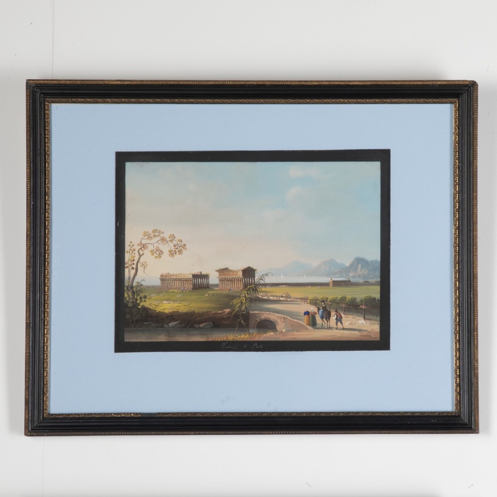A set of four framed 19th-century Neapolitan gouache landscape paintings depicting coastal scenes and classical Italian ruins in dark wooden frames with light blue mounts. View III
