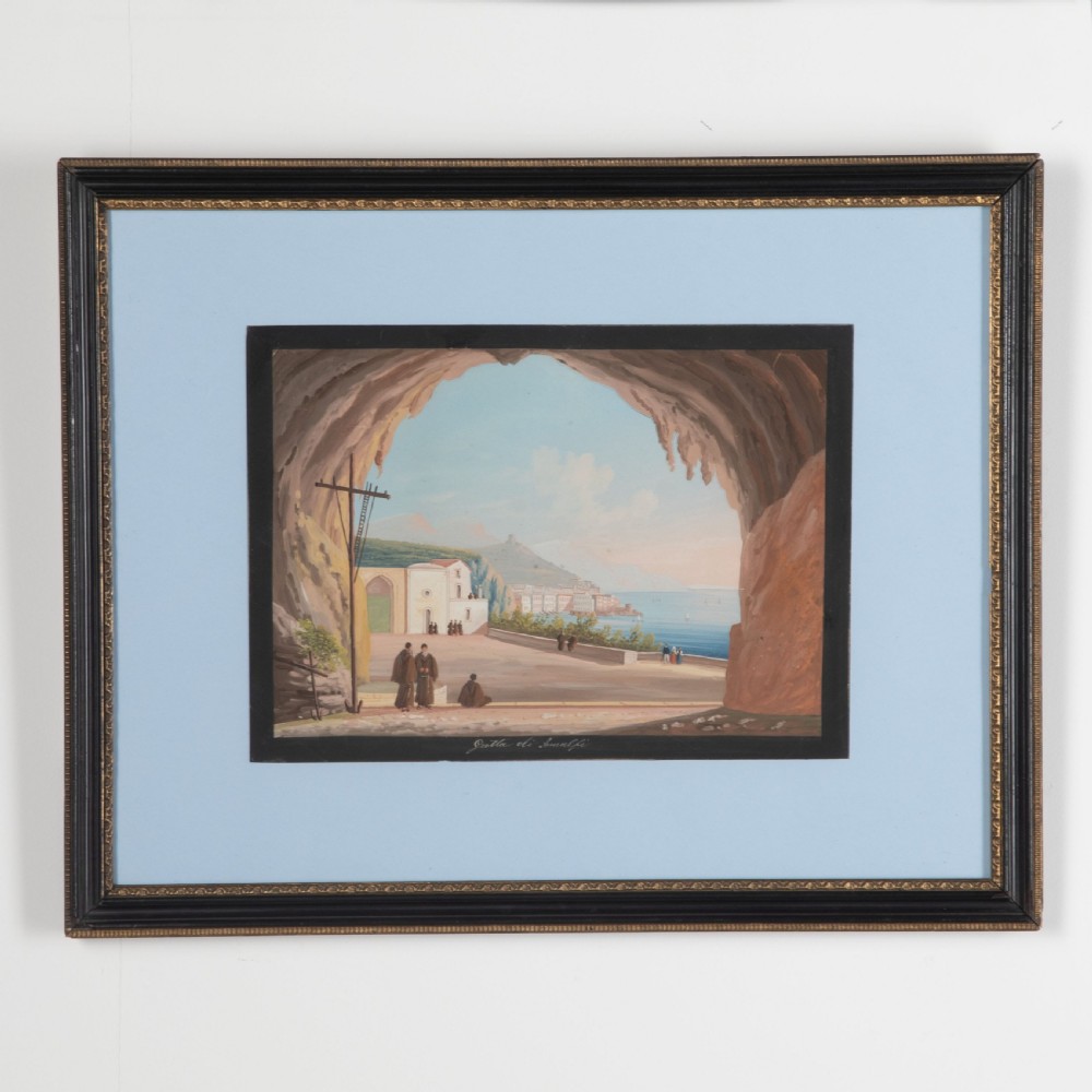 A set of four framed 19th-century Neapolitan gouache landscape paintings depicting coastal scenes and classical Italian ruins in dark wooden frames with light blue mounts. View IV