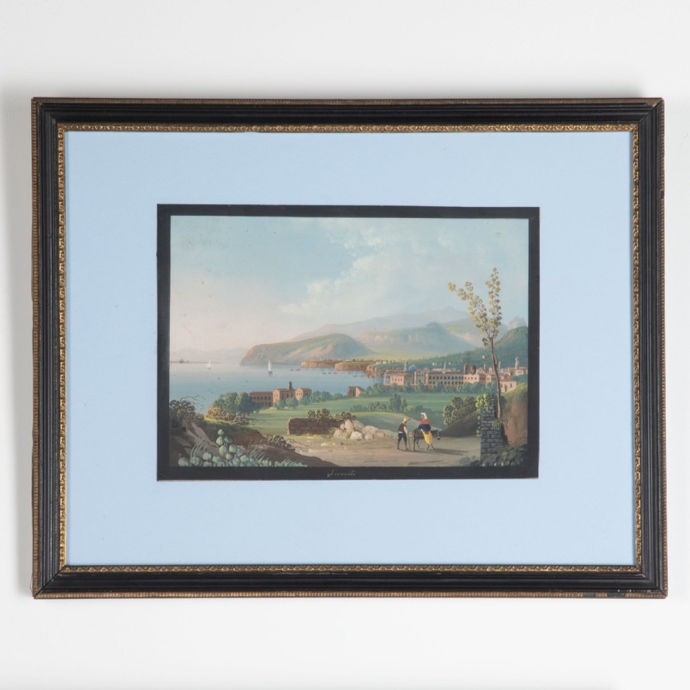 A set of four framed 19th-century Neapolitan gouache landscape paintings depicting coastal scenes and classical Italian ruins in dark wooden frames with light blue mounts. View V